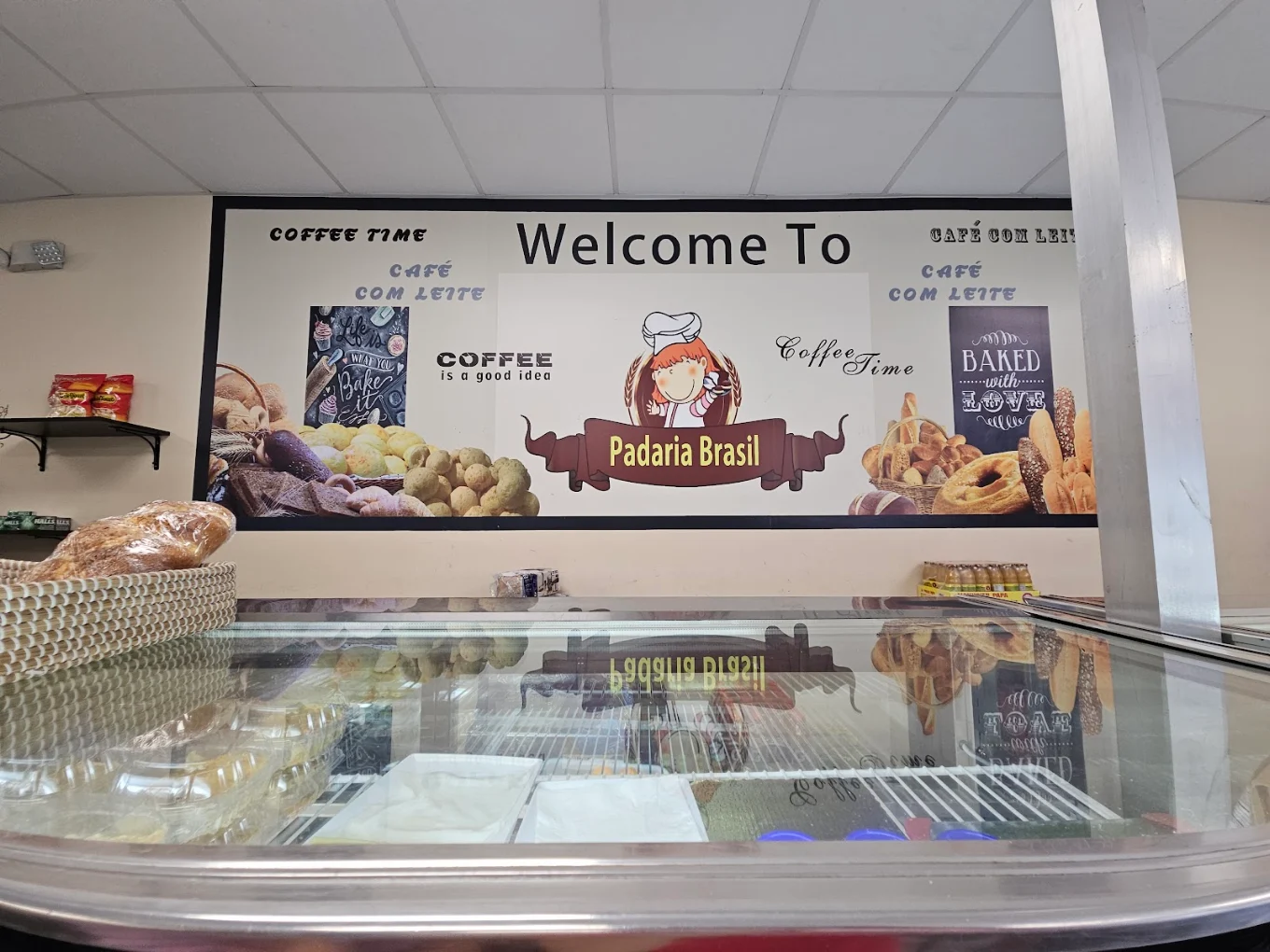 The counter and Padaria Brasil sign inside the bakery